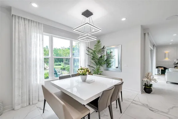 a view of a workspace with furniture and a living room