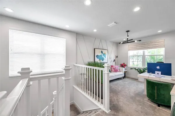 a bathroom with a sink mirror and a bathtub