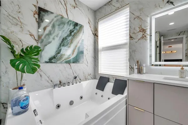 a view of a patio with table and chairs and potted plants