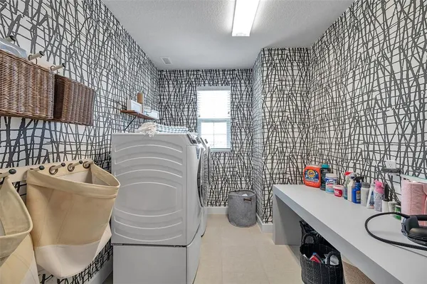 a building outdoor space with patio furniture and potted plants