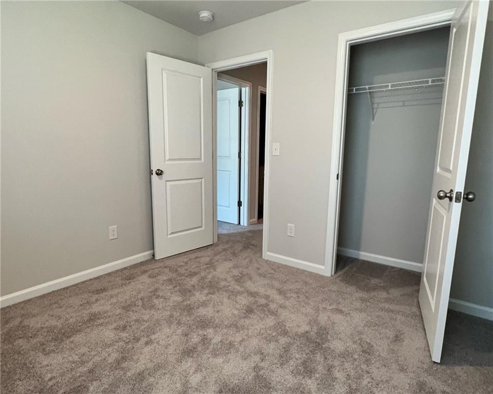 4352 Shaffer Ct Union, Unit 58 Union City, GA 30291 - Photo 16 of 19 wooden floor and closet in a room
