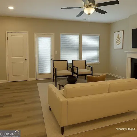 a living room with furniture and a window