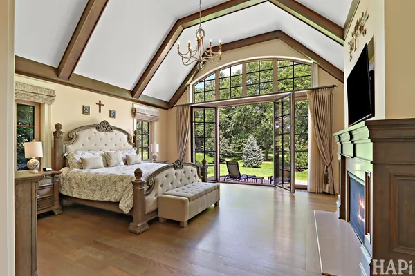 a bedroom with furniture and a flat screen tv
