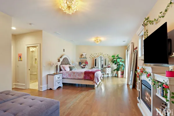 a view of an entryway with wooden floor and stairs
