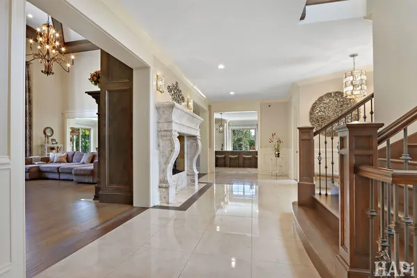 a living room with furniture a flat screen tv and a large window