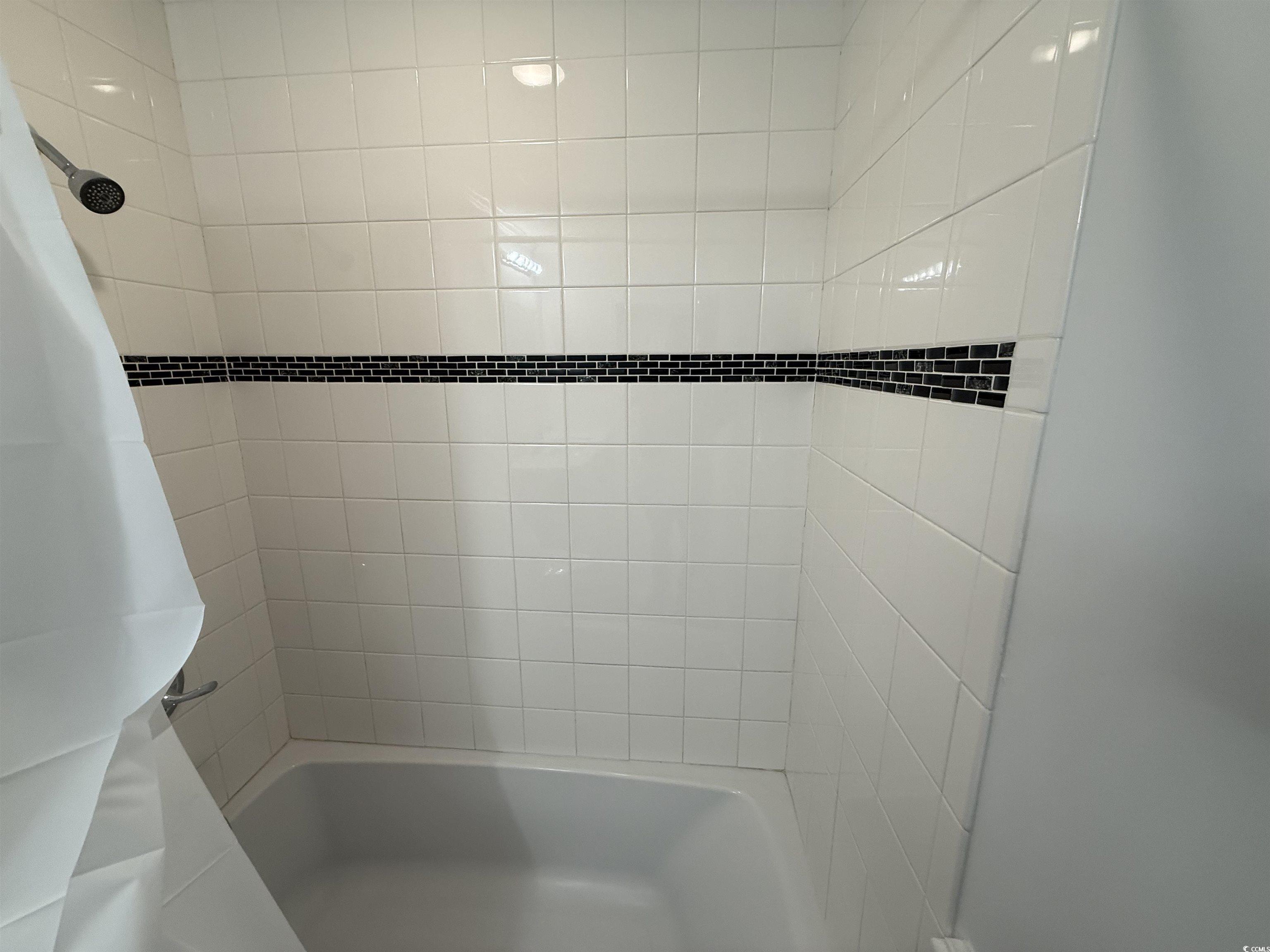 926 Forest Loop Road Conway, SC 29527 - Photo 12 of 14 Bathroom featuring shower / bath combination with curtain