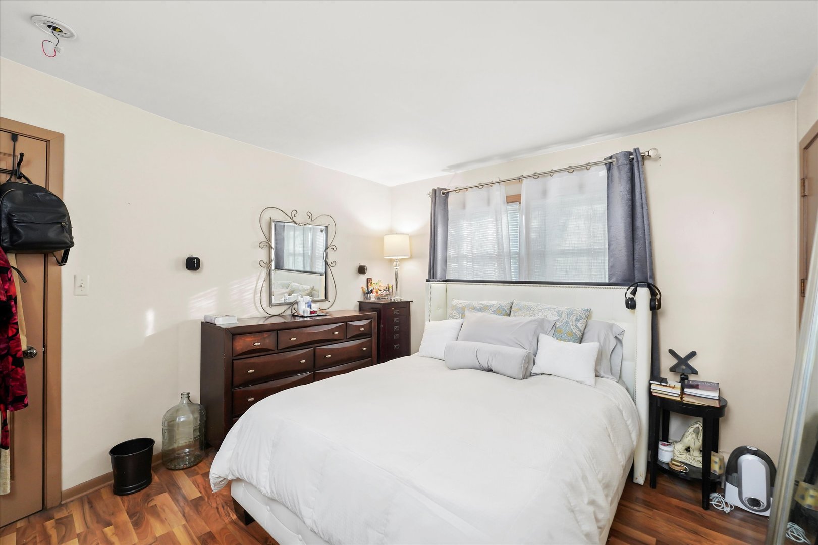 69 East Quincy Street, Unit 2 Riverside, IL 60546 - Photo 12 of 22 a bedroom with a bed and wooden floor