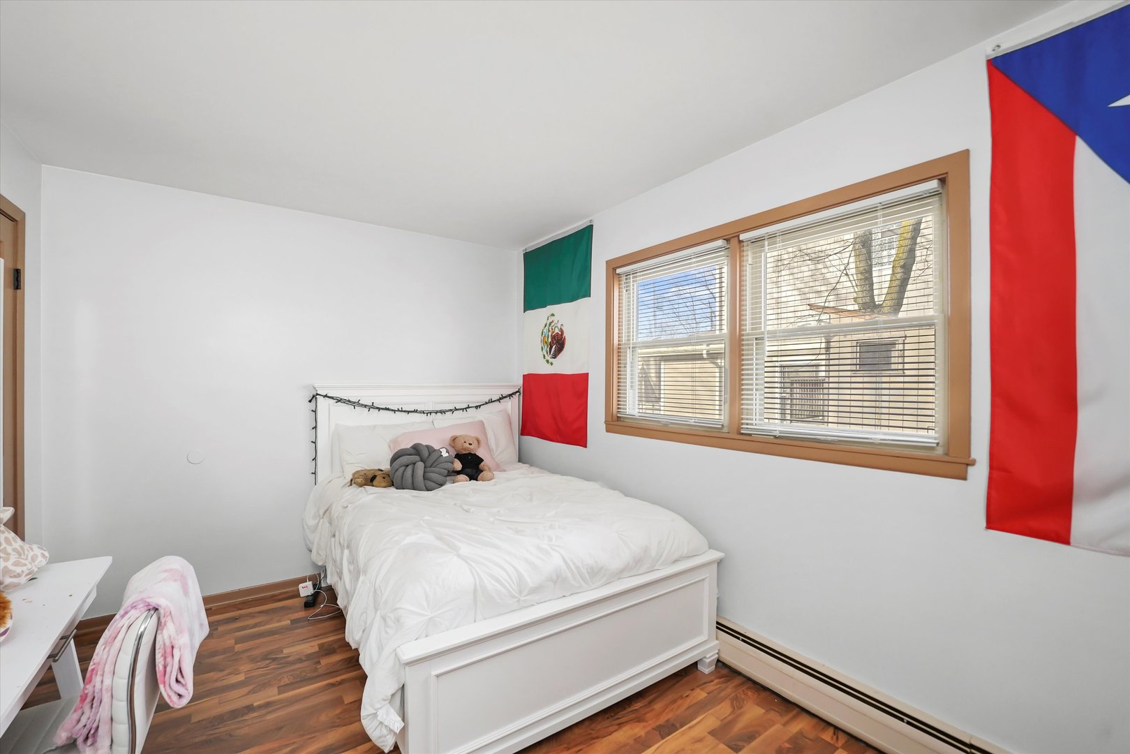 69 East Quincy Street, Unit 2 Riverside, IL 60546 - Photo 15 of 22 a bedroom with a bed and wooden floor