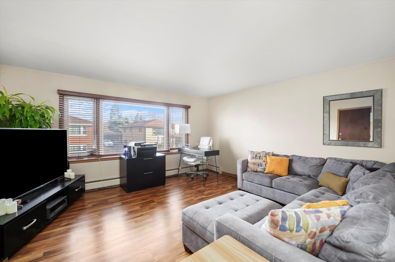 69 East Quincy Street, Unit 2 Riverside, IL 60546 - Photo 3 of 22 a living room with furniture and a flat screen tv