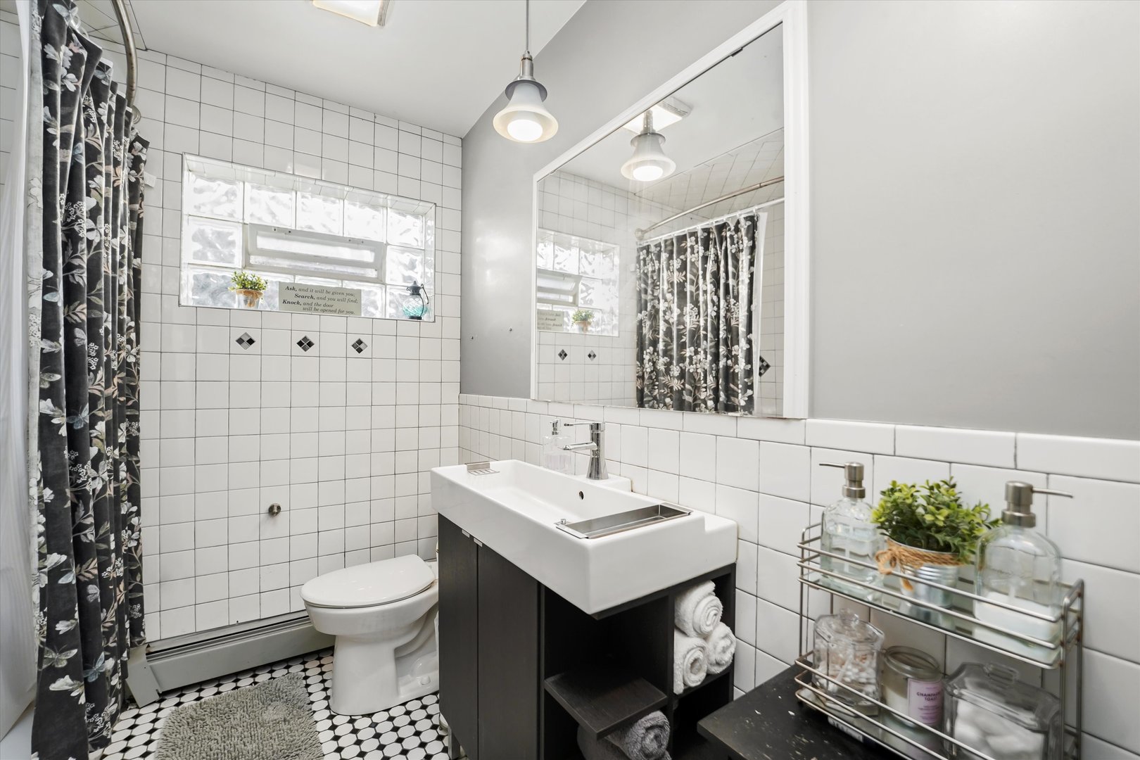 69 East Quincy Street, Unit 2 Riverside, IL 60546 - Photo 6 of 22 a bathroom with a sink toilet and shower