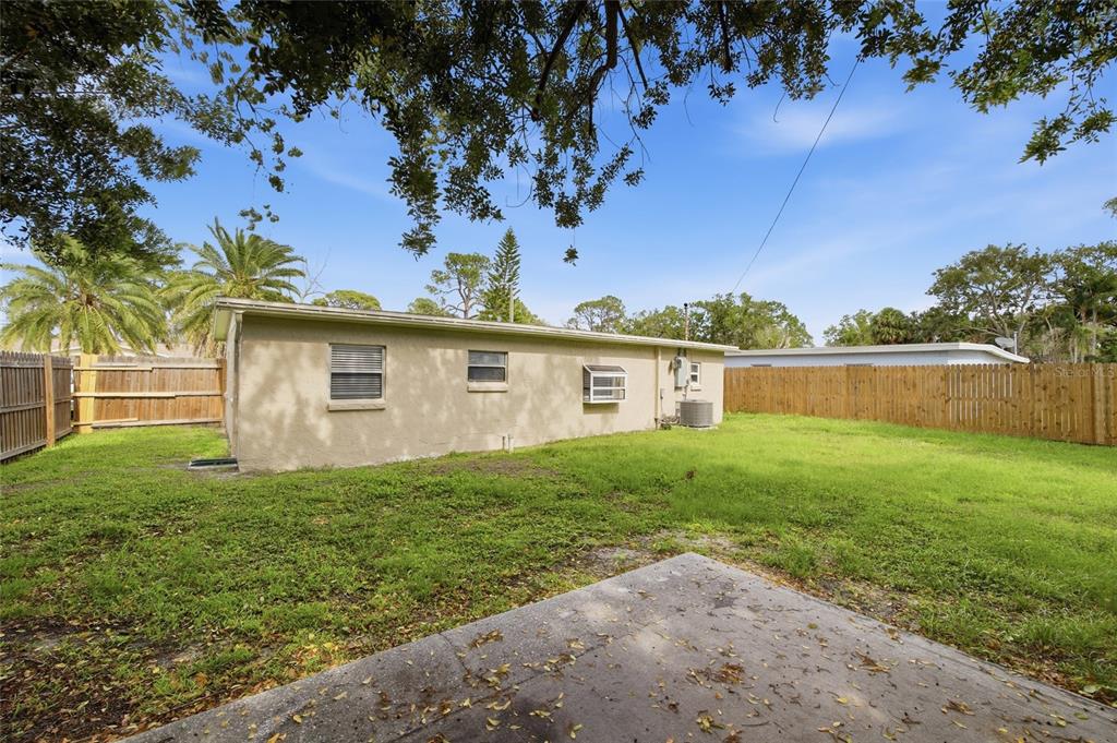 6629 Sierra Terrace New Port Richey, FL 34652 - Photo 20 of 30 a view of a backyard with a garden