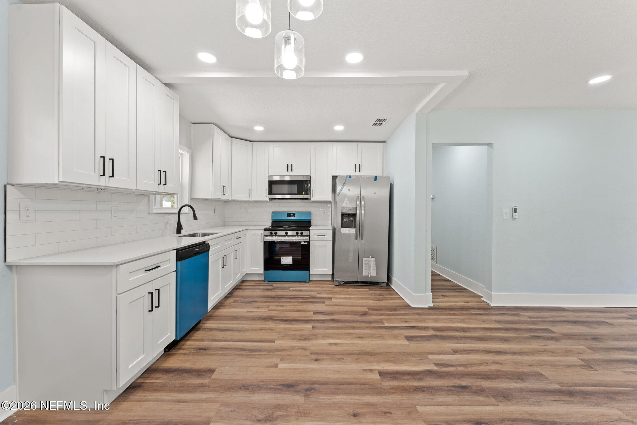2655 Community Road Jacksonville, FL 32207 - Photo 11 of 26 a large kitchen with stainless steel appliances granite countertop a stove and a refrigerator