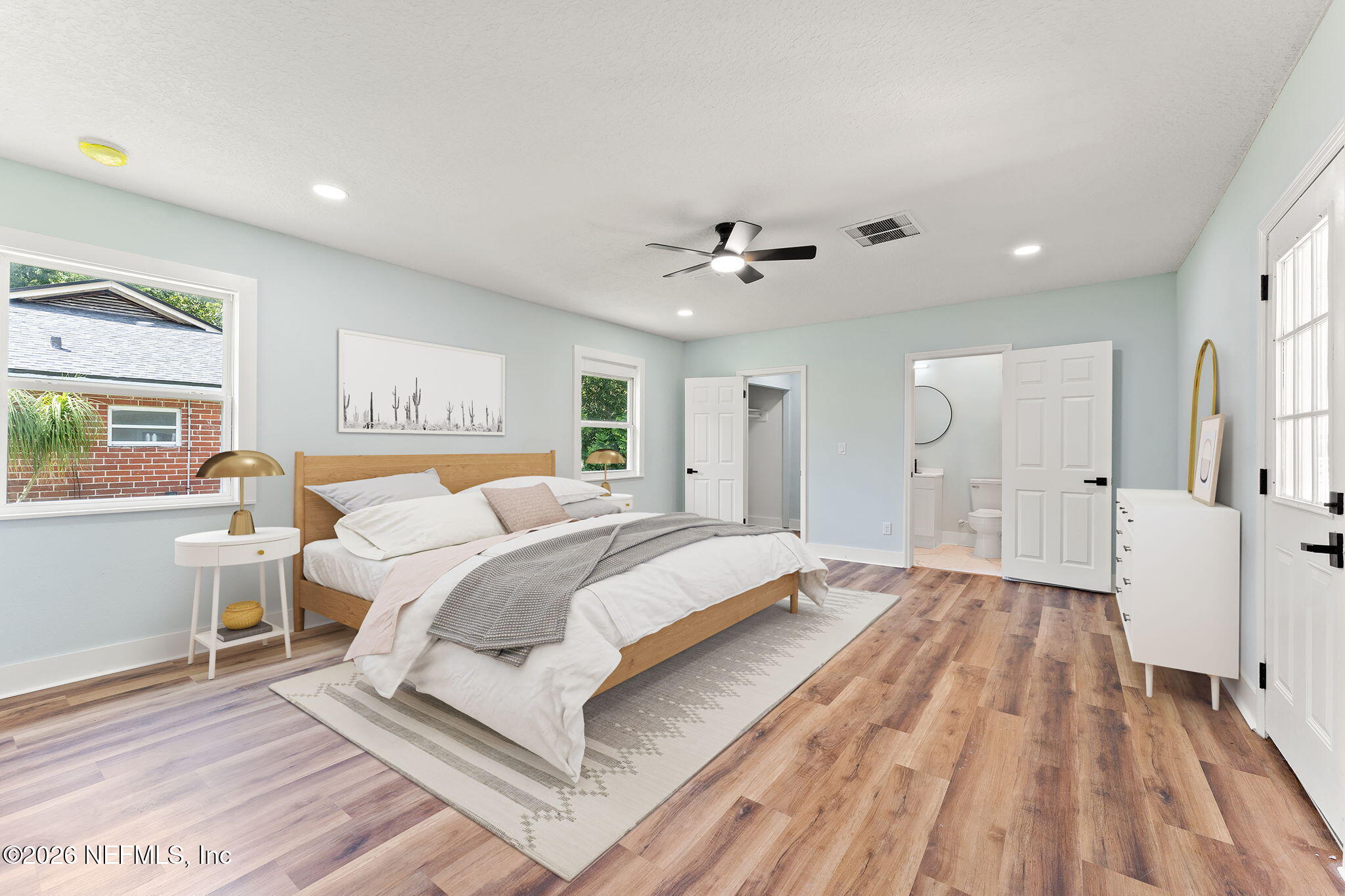 2655 Community Road Jacksonville, FL 32207 - Photo 16 of 26 a spacious bedroom with a bed and a chandelier