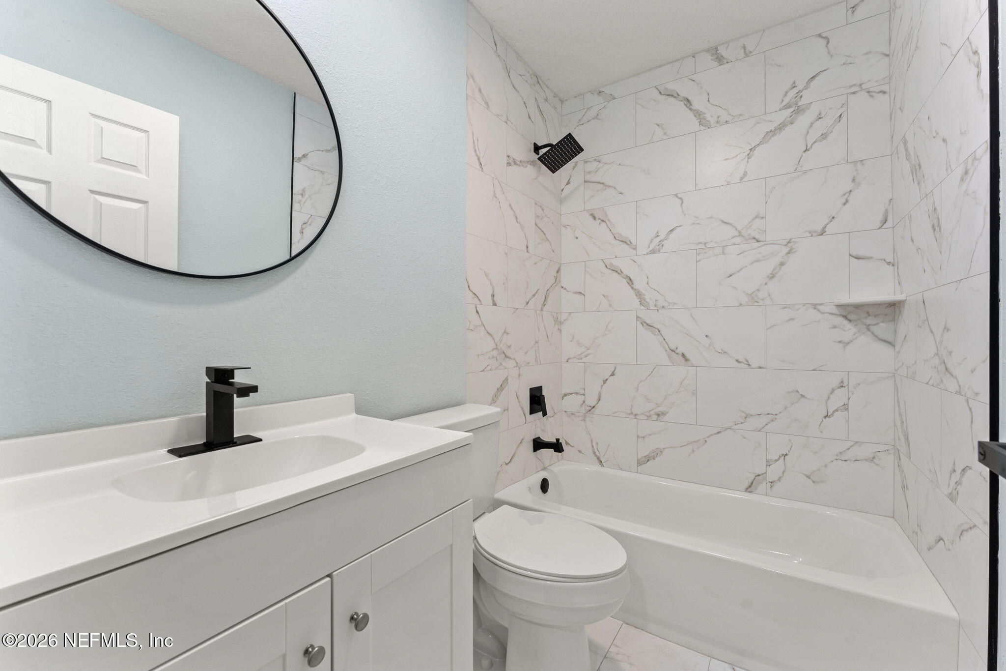2655 Community Road Jacksonville, FL 32207 - Photo 17 of 26 a bathroom with a sink a toilet and bathtub