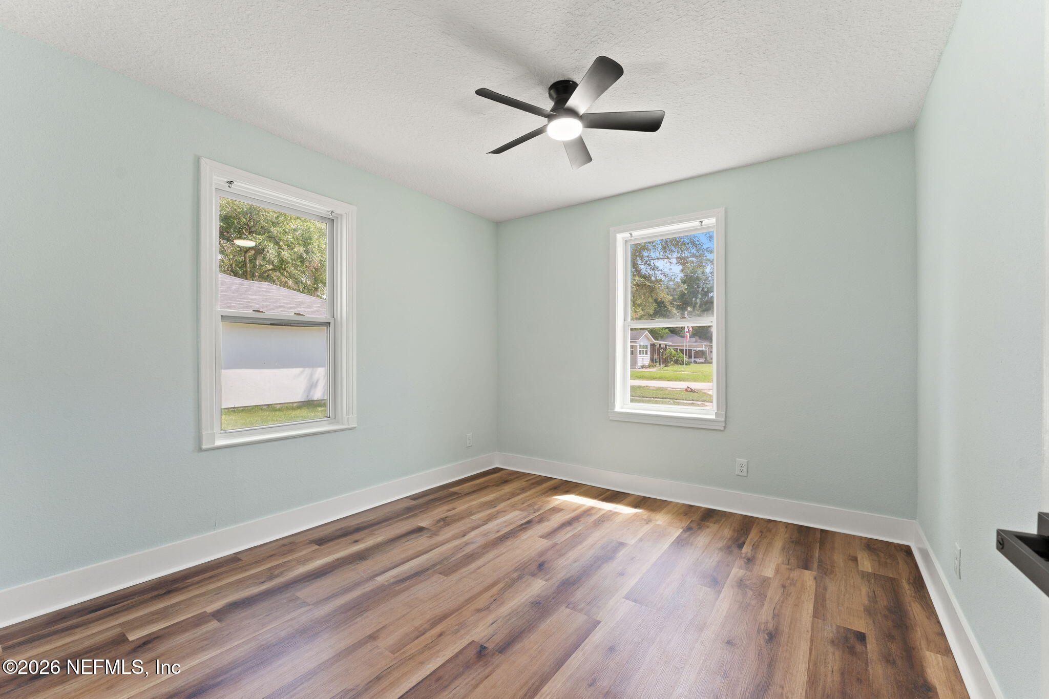 2655 Community Road Jacksonville, FL 32207 - Photo 19 of 26 a view of empty room with wooden floor and window
