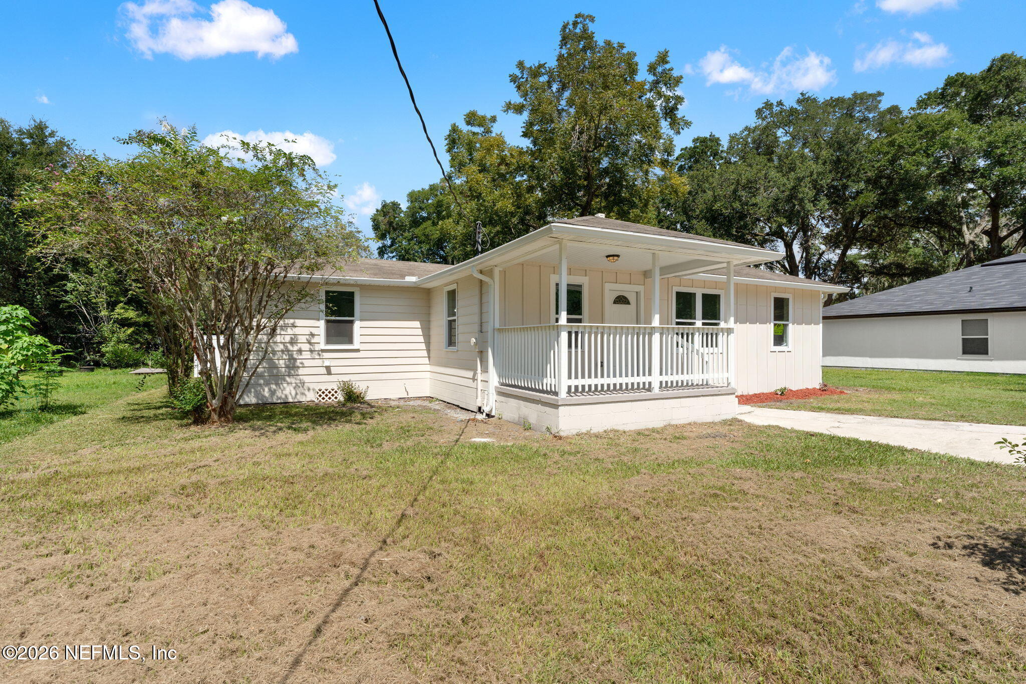 2655 Community Road Jacksonville, FL 32207 - Photo 2 of 26 a front view of a house with a garden