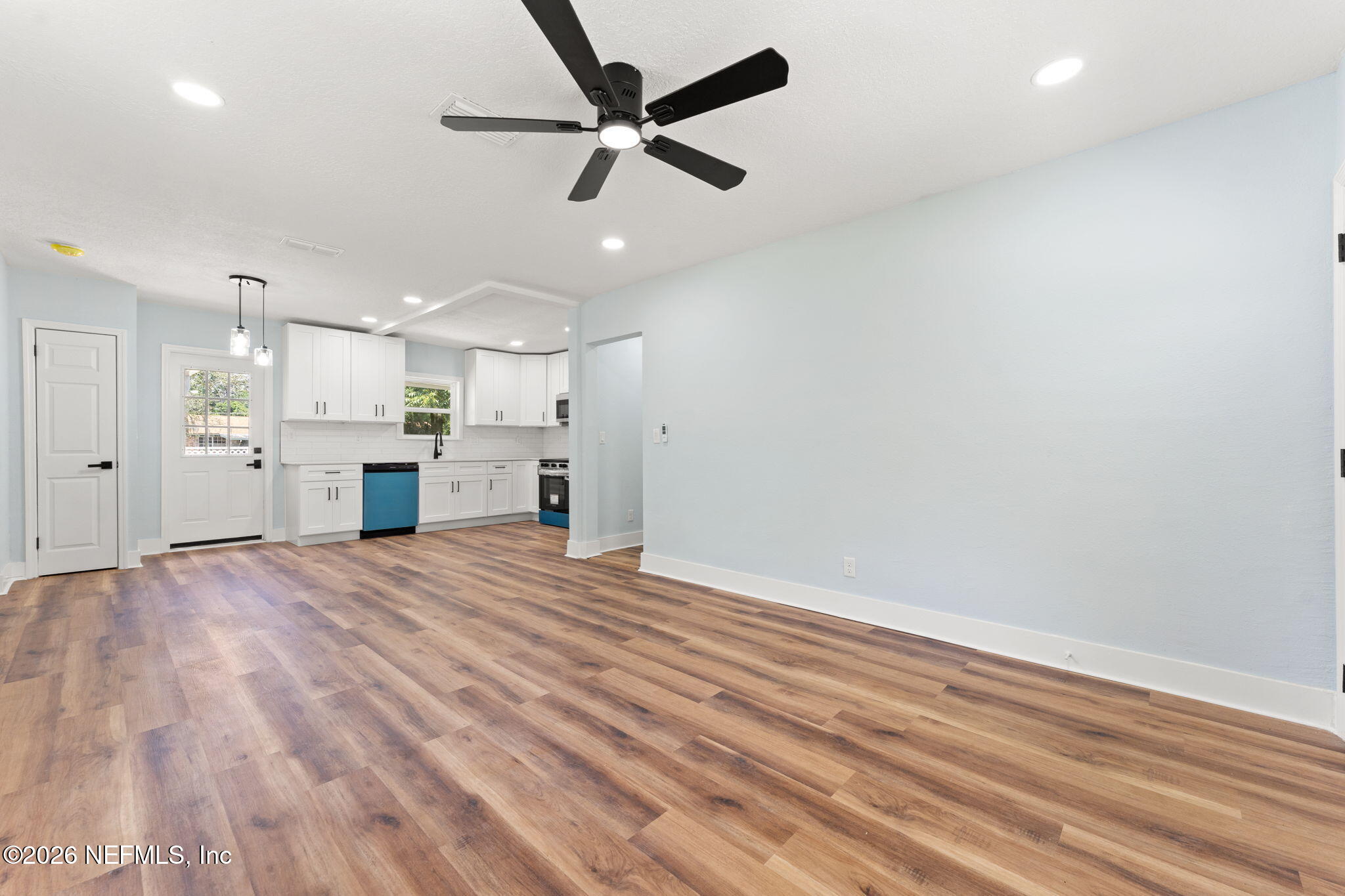 2655 Community Road Jacksonville, FL 32207 - Photo 7 of 26 a view of an empty room with a kitchen