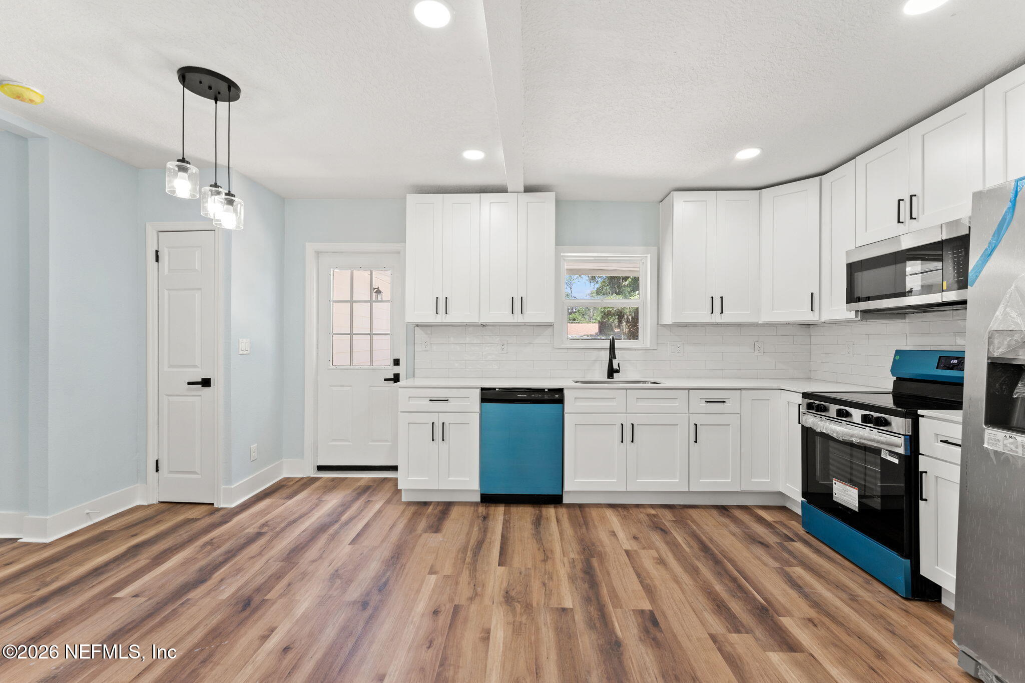2655 Community Road Jacksonville, FL 32207 - Photo 10 of 26 a large kitchen with stainless steel appliances granite countertop a stove and a sink