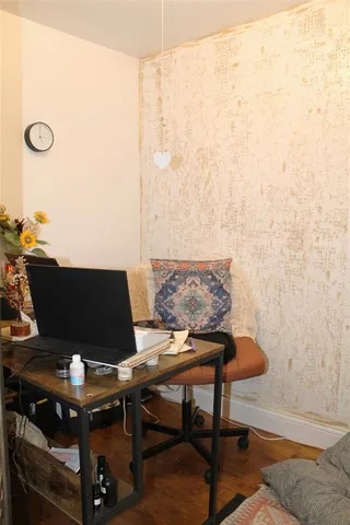 a view of workspace with wooden floor