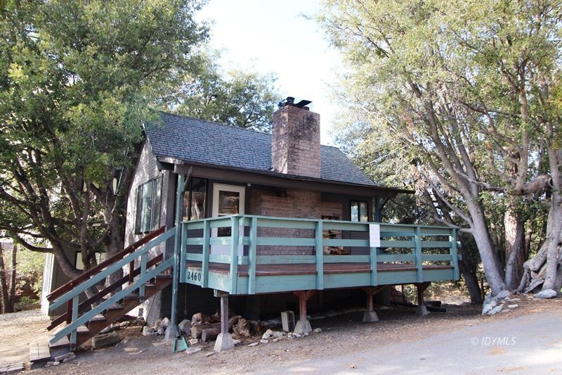 24601 Bluff Road Idyllwild, CA 92549 - Photo 1 of 24 a front view of a house with a balcony