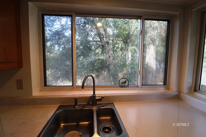 24601 Bluff Road Idyllwild, CA 92549 - Photo 11 of 24 a bathroom with a sink and a large window