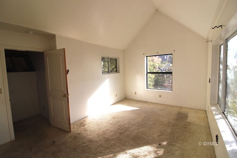 24601 Bluff Road Idyllwild, CA 92549 - Photo 13 of 24 an empty room with windows and closet
