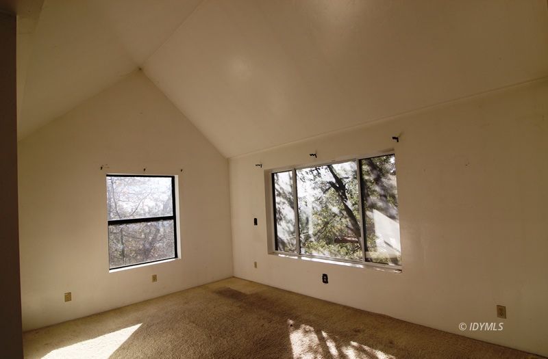 24601 Bluff Road Idyllwild, CA 92549 - Photo 14 of 24 an empty room with large windows