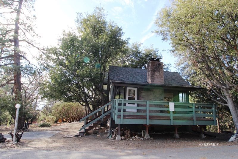24601 Bluff Road Idyllwild, CA 92549 - Photo 3 of 24 a front view of a house with a garden