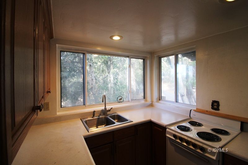 24601 Bluff Road Idyllwild, CA 92549 - Photo 10 of 24 a kitchen with a large window and a sink