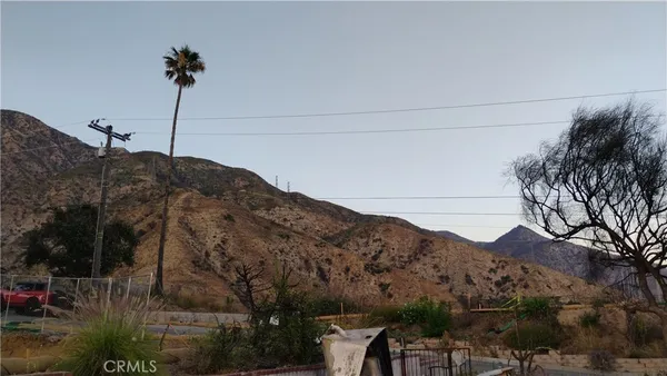 a view of a house with a mountain and a mountain view