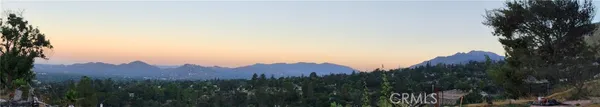 a view of a city with a mountain in the background