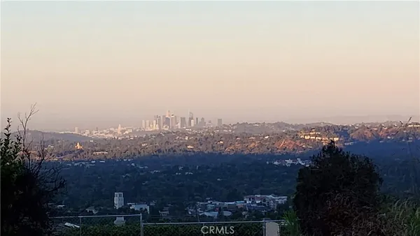 an aerial view of residential building and trees around