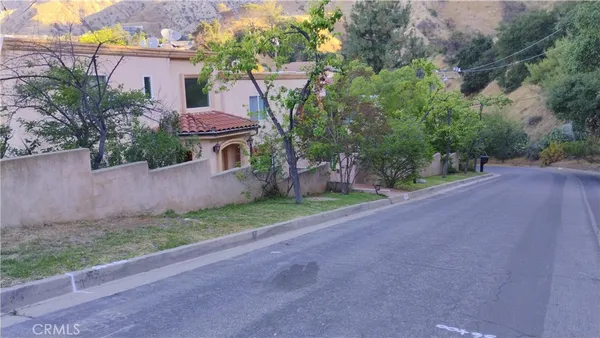 a view of a street with a house