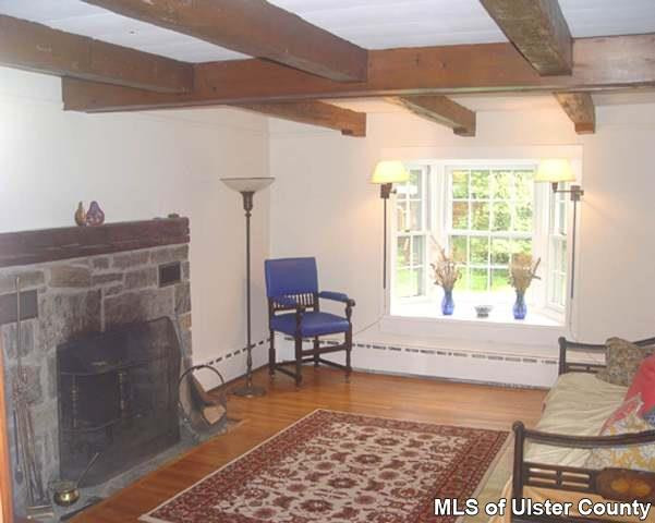 101 Oakley Stone Ridge, NY 12484 - Photo 1 of 4 a living room with furniture and a window