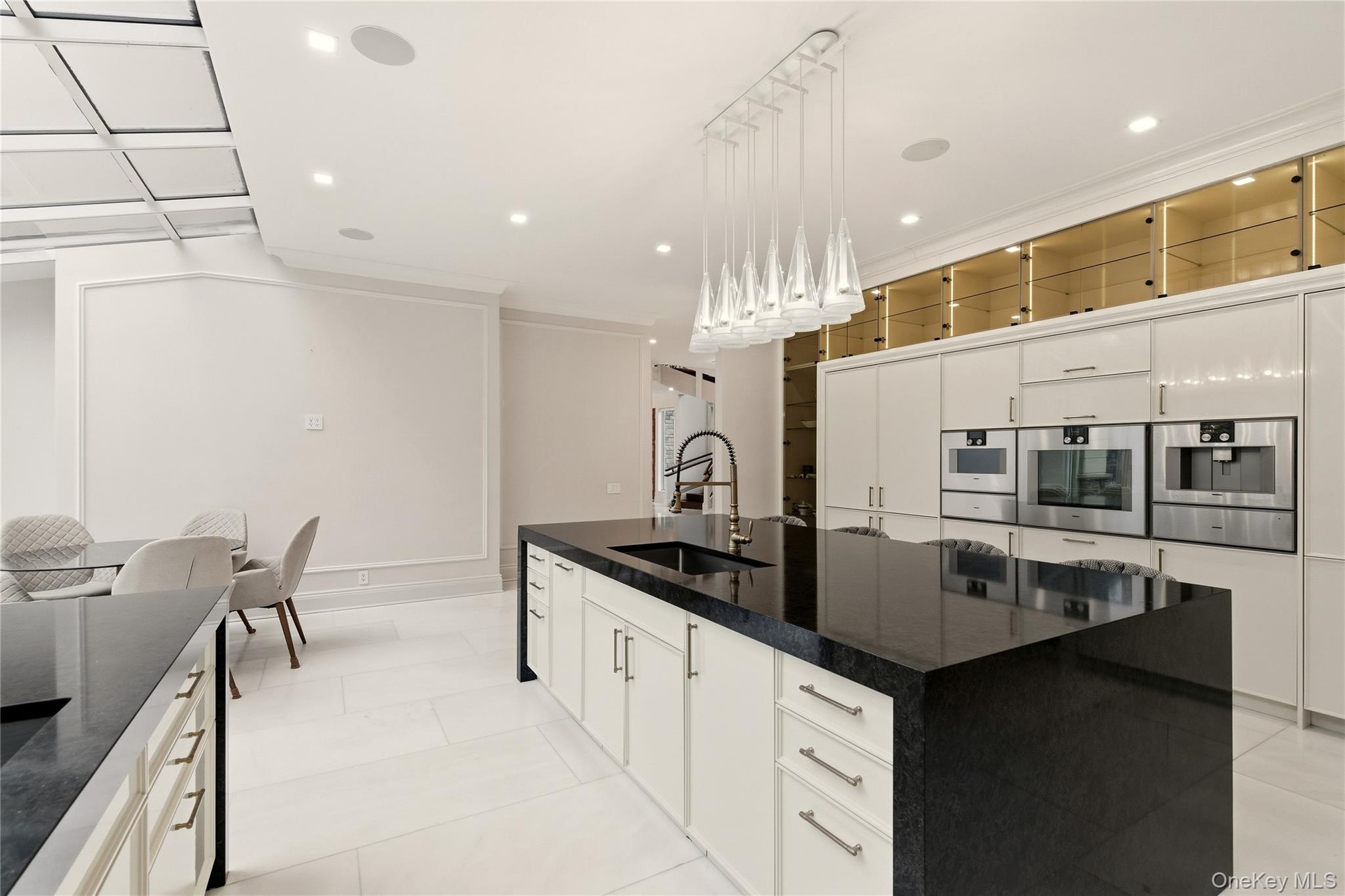 55 Coves Run Syosset, NY 11791 - Photo 17 of 50 a kitchen with granite countertop a stove and a sink