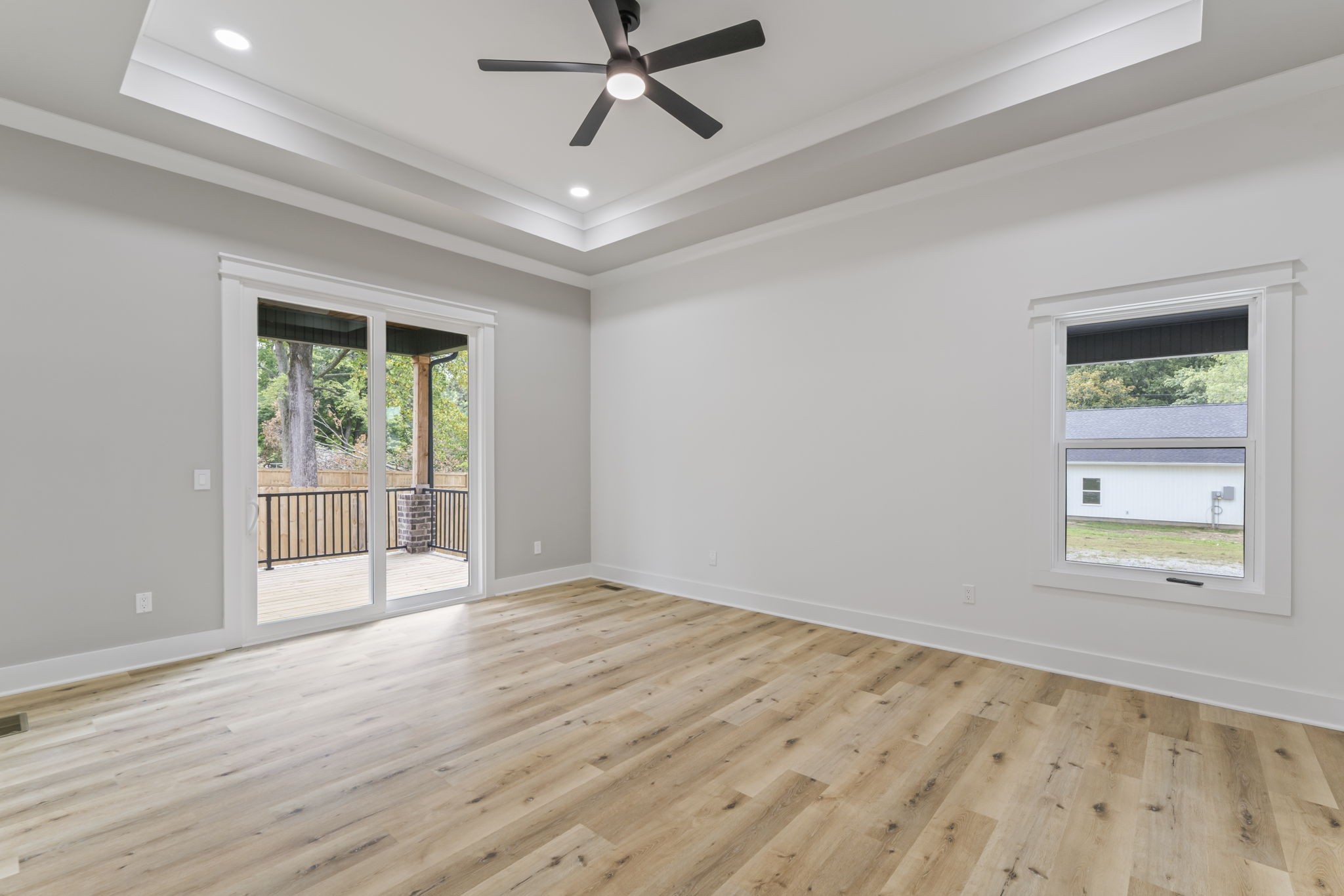 1601 Old Estill Springs Road Tullahoma, TN 37388 - Photo 19 of 37 an empty room with wooden floor fan and windows