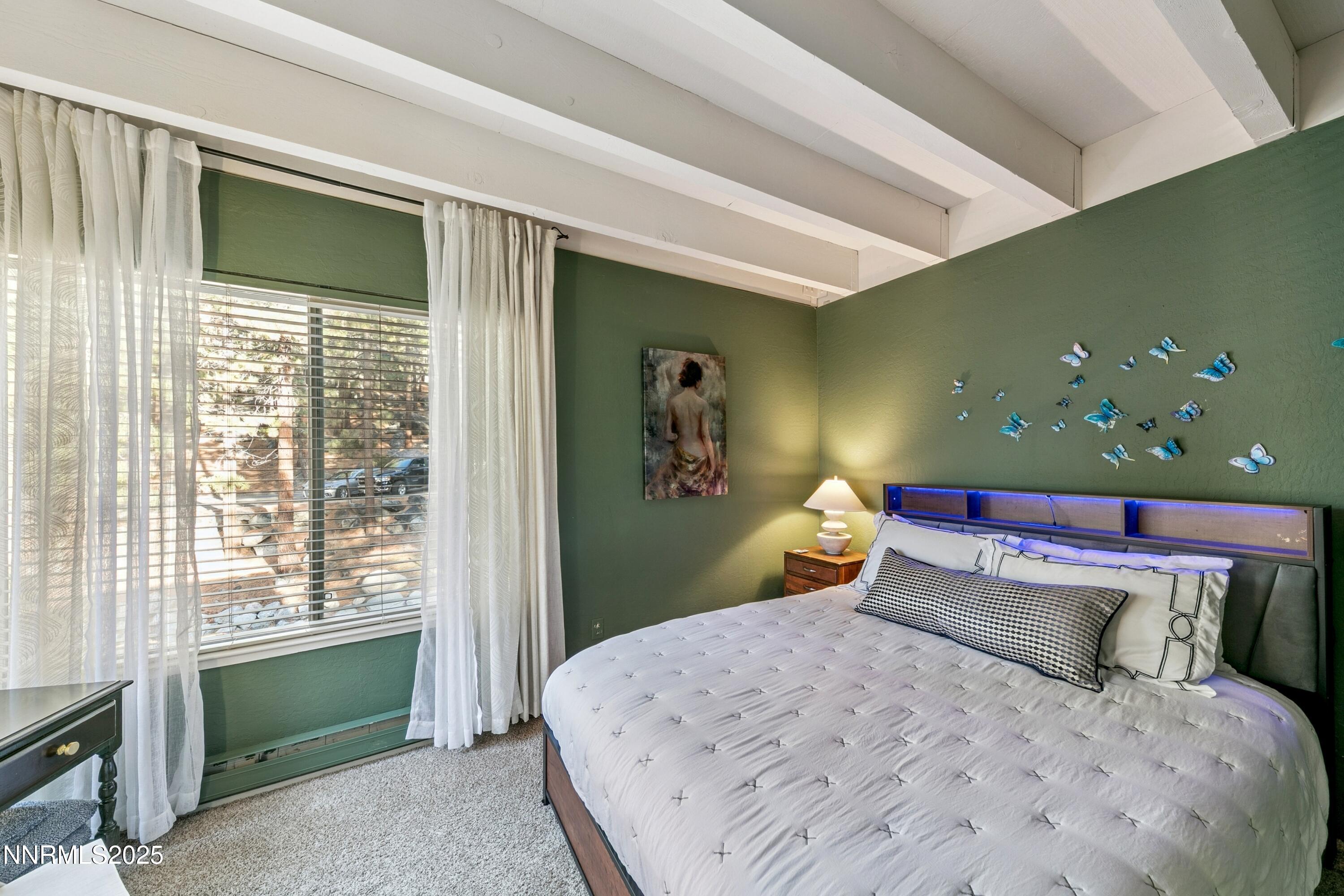 230 Clubhouse Circle Stateline, NV 89449 - Photo 20 of 44 a bedroom with a bed and a window