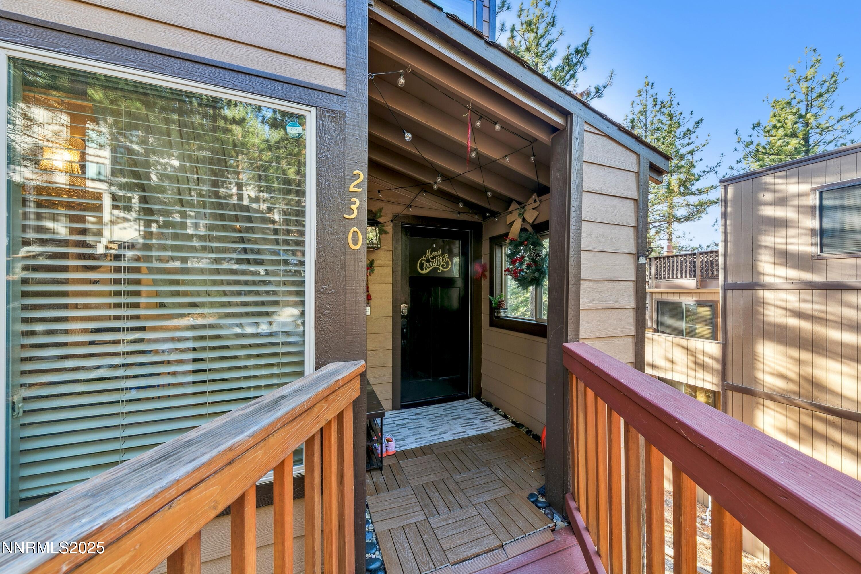 230 Clubhouse Circle Stateline, NV 89449 - Photo 2 of 44 a view of a balcony with wooden floor and fence