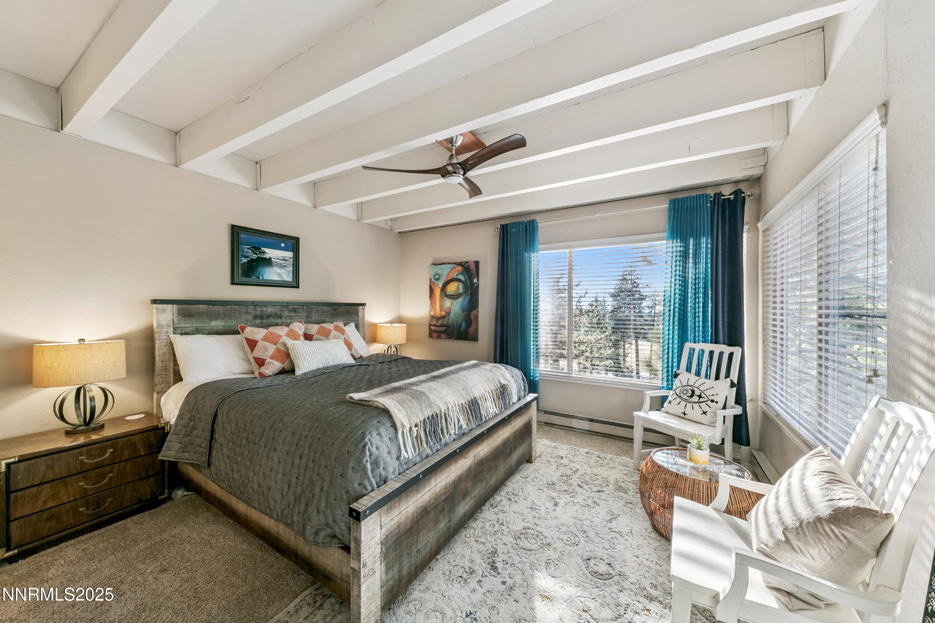 230 Clubhouse Circle Stateline, NV 89449 - Photo 24 of 44 a spacious bedroom with a bed and a window