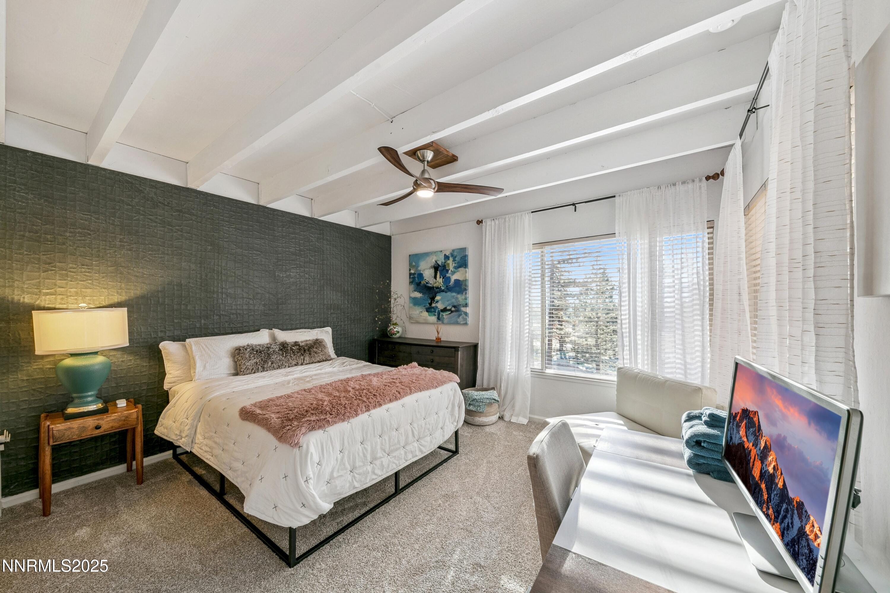 230 Clubhouse Circle Stateline, NV 89449 - Photo 25 of 44 a bedroom with a bed couch and window