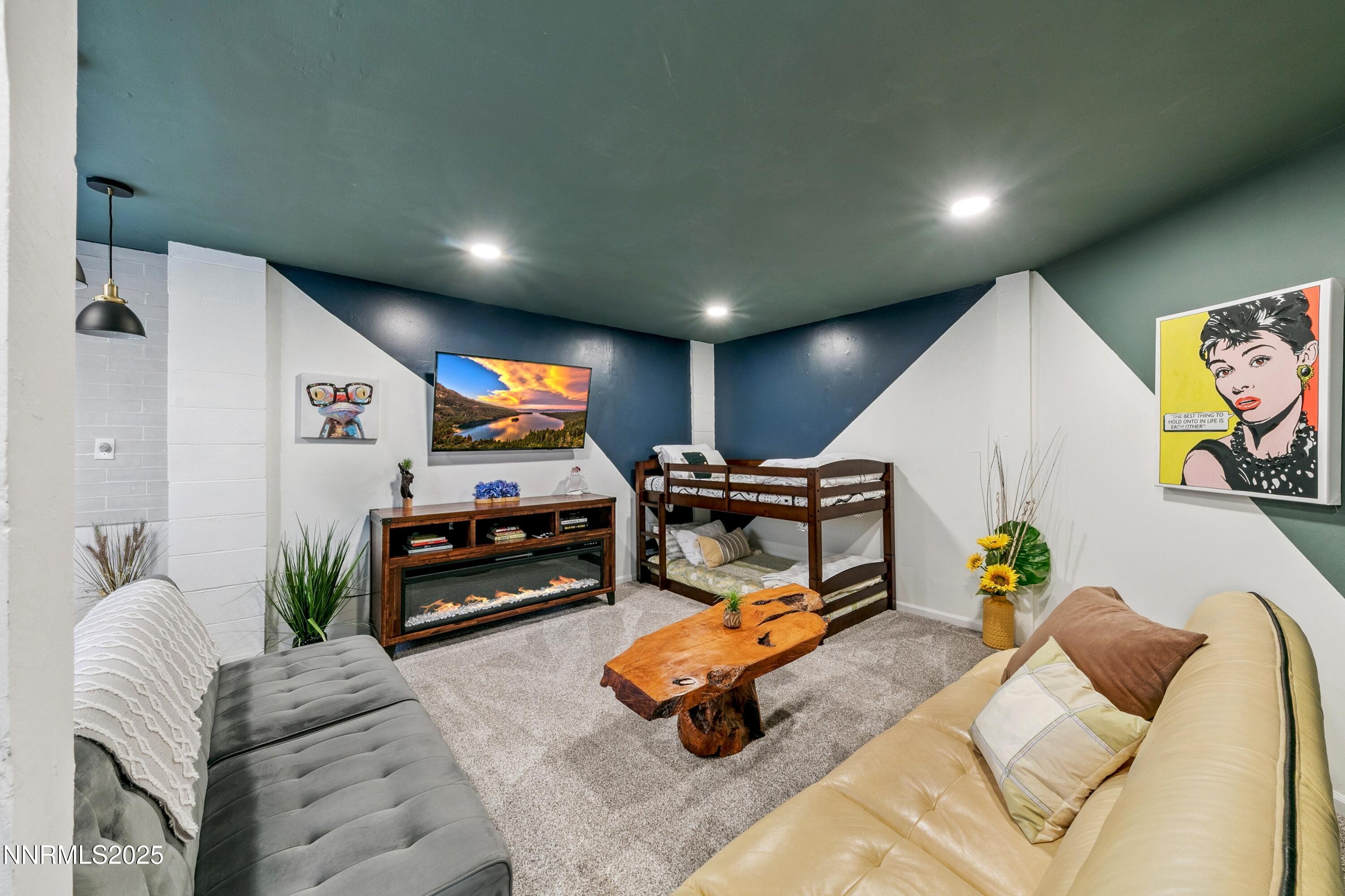 230 Clubhouse Circle Stateline, NV 89449 - Photo 29 of 44 a living room with furniture and a flat screen tv