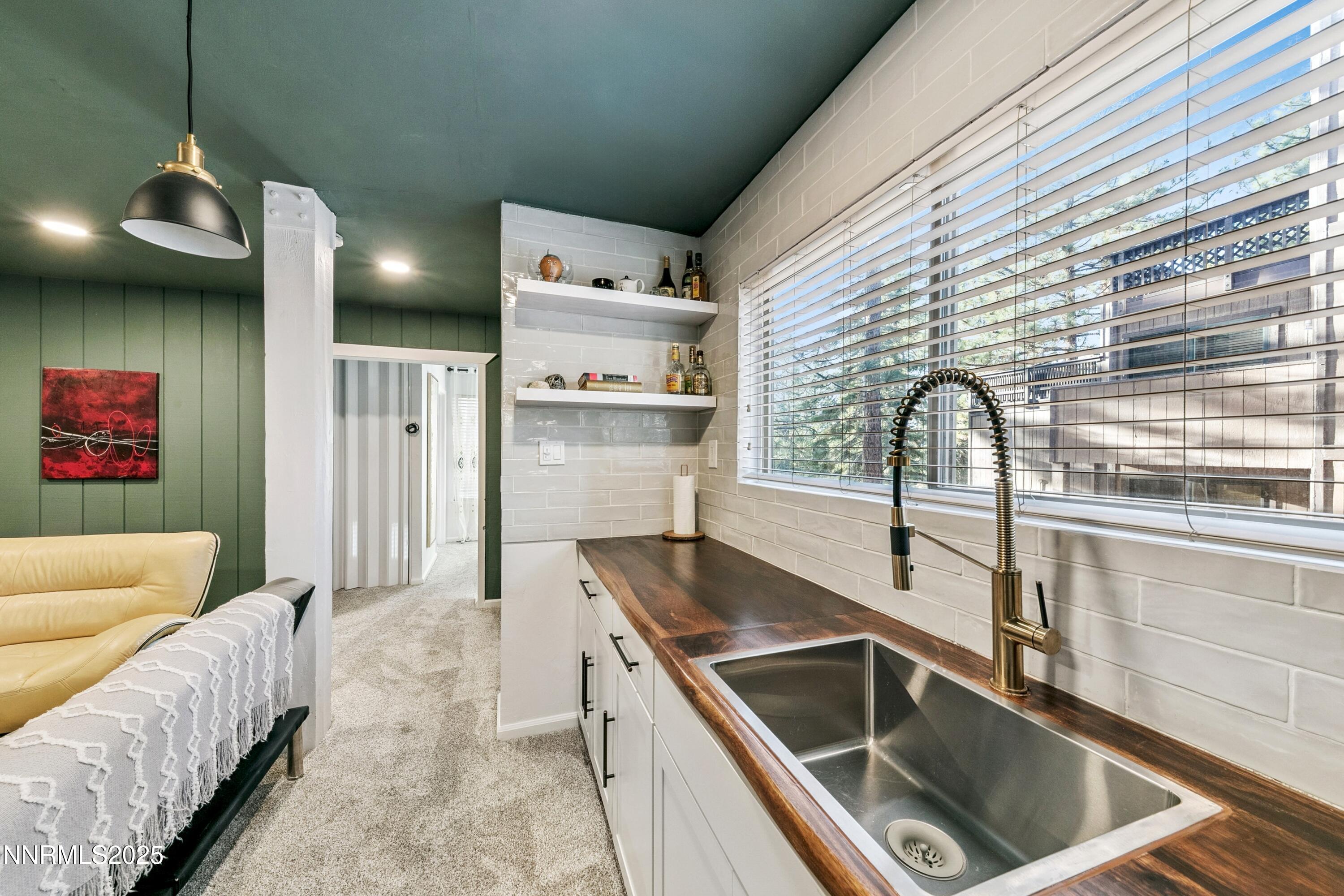 230 Clubhouse Circle Stateline, NV 89449 - Photo 30 of 44 a kitchen with a sink cabinets and a large window
