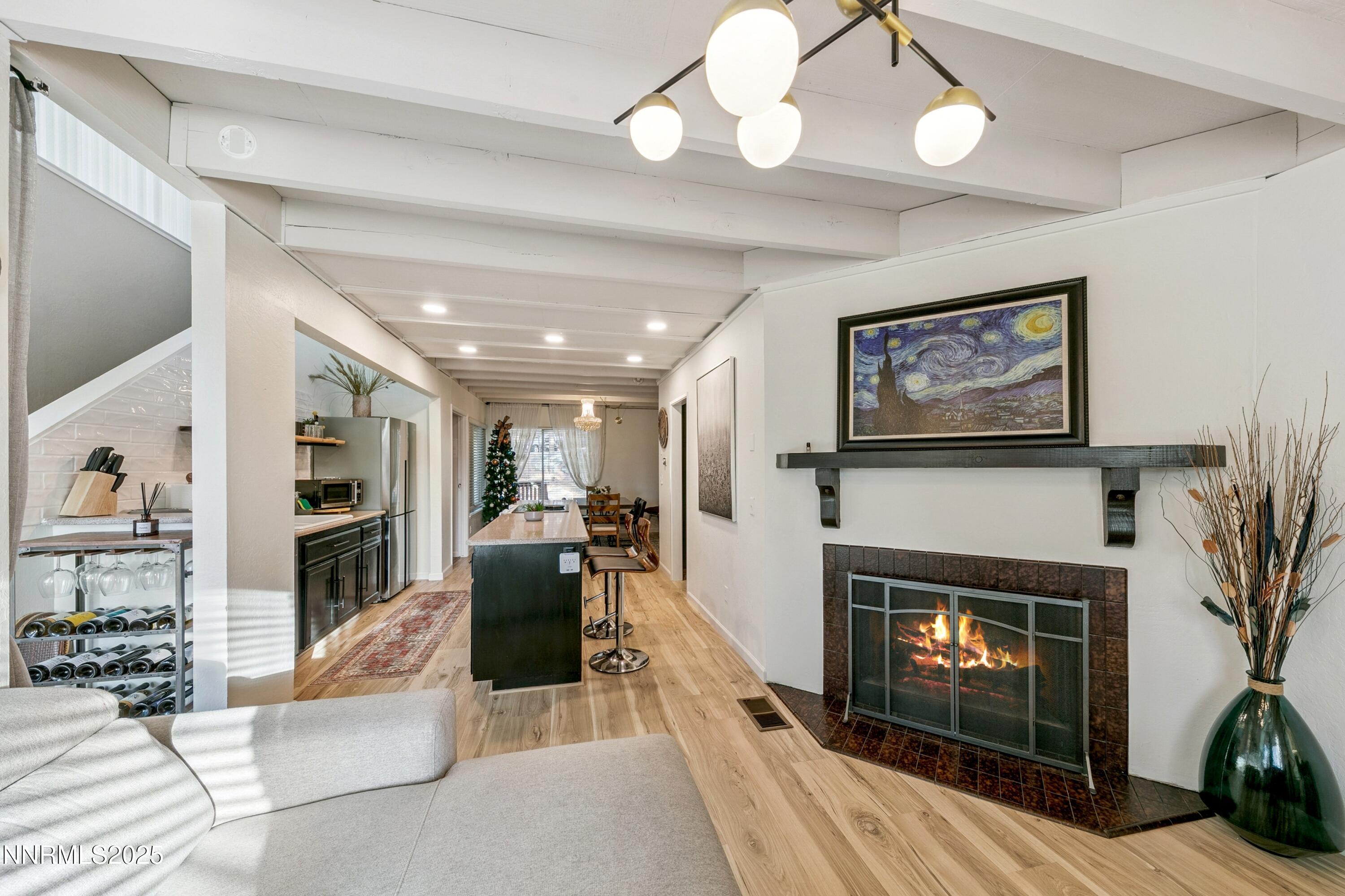 230 Clubhouse Circle Stateline, NV 89449 - Photo 6 of 44 a living room with furniture a flat screen tv and a fireplace