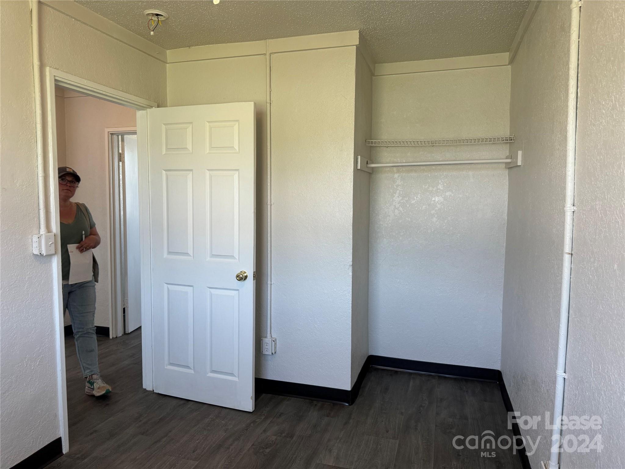 200 York Street, Unit M6 Chester, SC 29706 - Photo 13 of 14 a view of an empty room with wooden floor and closet