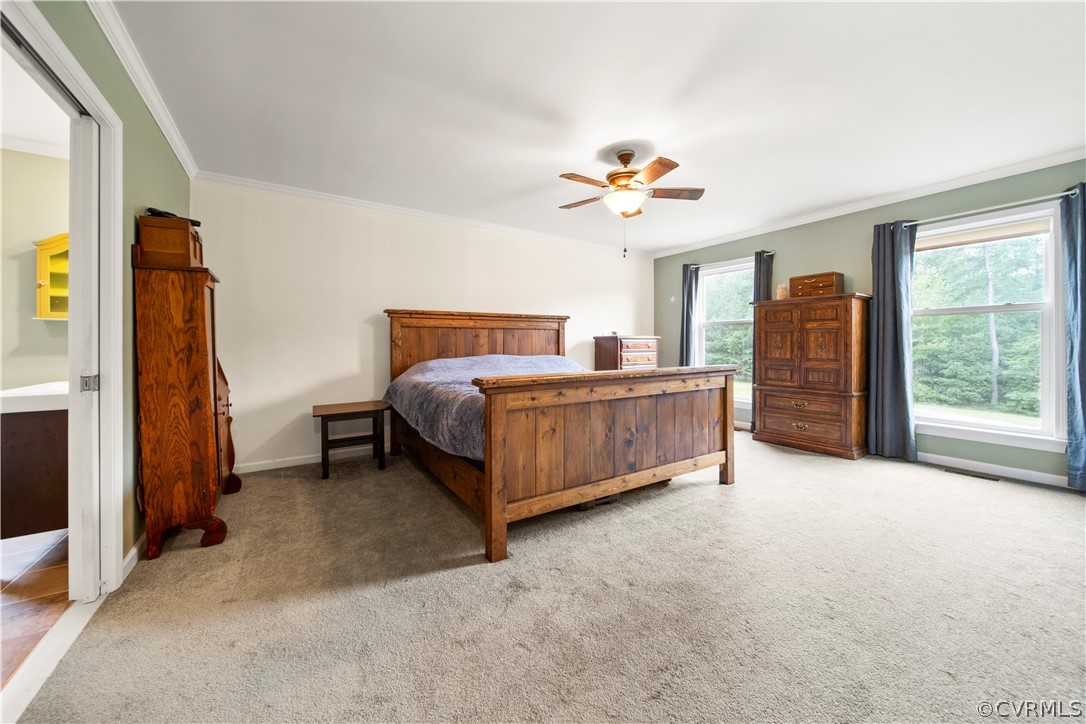 2577 Pleasant Oak Road Victoria, VA 23974 - Photo 18 of 38 a bedroom with a bed and a chandelier