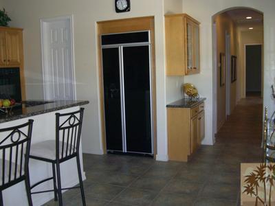 303 Loch Lomond Road Rancho Mirage, CA 92270 - Photo 11 of 25 a view of a hallway to a livingroom with furniture