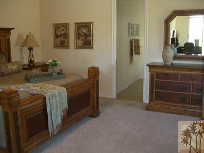 303 Loch Lomond Road Rancho Mirage, CA 92270 - Photo 17 of 25 a bed room with a bed and a television