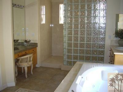 303 Loch Lomond Road Rancho Mirage, CA 92270 - Photo 18 of 25 a bathroom with a tub sink and shower