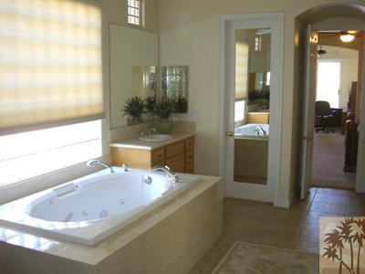 303 Loch Lomond Road Rancho Mirage, CA 92270 - Photo 19 of 25 a bathroom with a bathtub and shower
