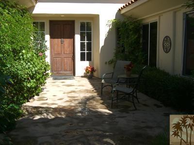 303 Loch Lomond Road Rancho Mirage, CA 92270 - Photo 2 of 25 a view of a house with backyard and sitting area